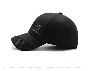 Side-rear detail of black woolen baseball cap with leather trim and embroidery