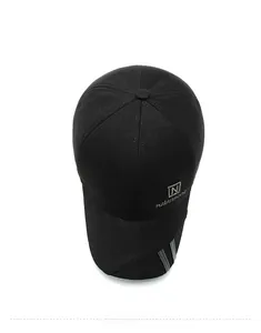 Top down view of black wool baseball cap with silver embroidery and grey brim stripes