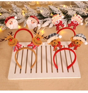 Detailed view of Christmas headbands with Santa, Snowman, Reindeer and Bear plush characters