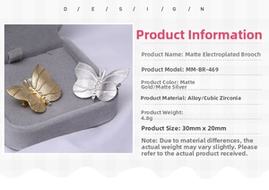 Detail view of matte gold and silver butterfly brooches with rhinestones and size specs