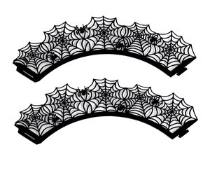 Detail of laser-cut black spider web cupcake liners with intricate spider patterns