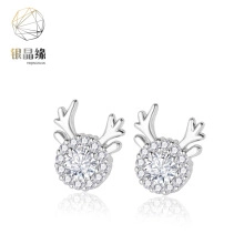 Close-up of reindeer stud earrings with cubic zirconia and polished silver plating