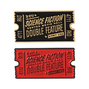 Retro science fiction movie ticket enamel pins in black-gold and red-black color options