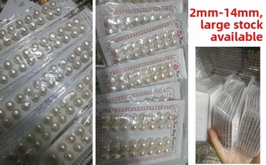 Wholesale natural freshwater button pearls displayed on cards ranging from 2mm to 14mm