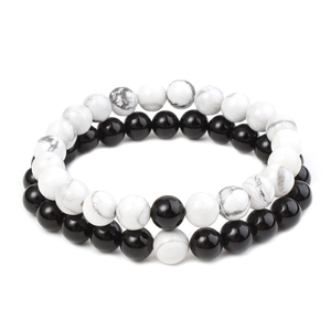 Detail of 8mm matte black beads and white turquoise stones on couple's bracelets