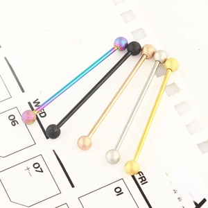 Industrial barbell piercing set with frosted balls in five metallic colors on paper