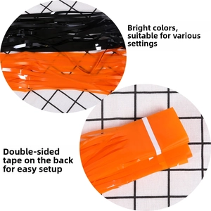 Detail of Halloween tinsel curtain with adhesive backing in orange and black color