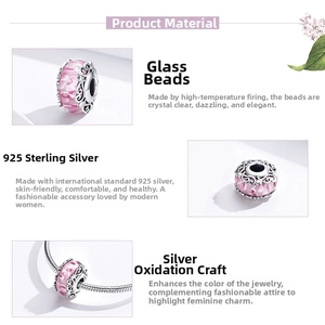 Detailed view of pink glass charm bead with S925 sterling silver oxidized hollow patterns