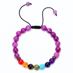 Detail of adjustable woven chakra bracelet with purple beads and seven colored natural stones