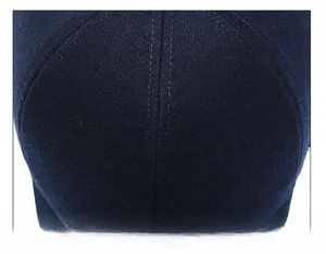 Detailed top view of navy wool baseball cap showing reinforced stitching and twill fabric