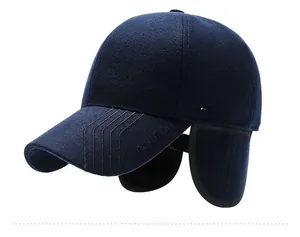 Detailed side view of winter wool baseball cap with ear flaps and silver brand logo