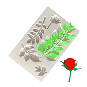 Silicone mold detail showing realistic leaf and red rose shapes for cake decorating
