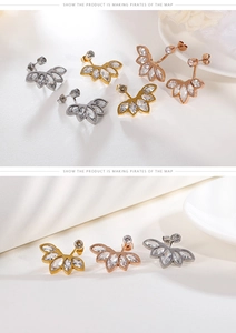 Detailed view of floral zircon stud earrings in gold, rose gold and silver finishes