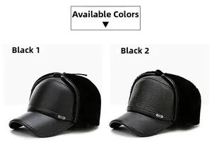 Close-up of two black leather winter hats with plush ear flaps and metal brim details