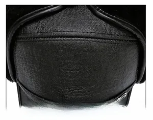 Macro view of stitching details and SPORT metal badge on black leather winter hat