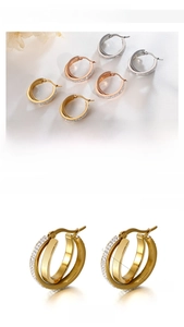 Detailed view of triple-layered titanium steel hoop earrings with sparkling rhinestones