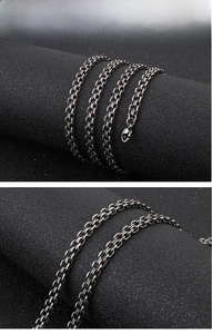 Close-up of vintage silver stainless steel double-layered chain with lobster clasp detail
