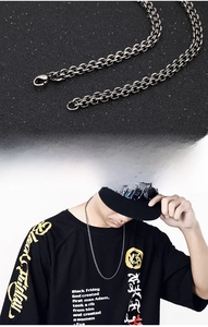 Detail of vintage double-layer stainless steel chain necklace with lobster clasp