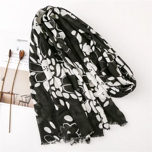 Long black and white floral cotton linen scarf with frayed edges and abstract pattern