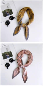 Detail of pleated silk scarf with chain pattern and stylish sunglasses on a magazine