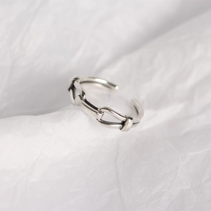 Macro detail of 925 sterling silver chain link ring with adjustable open band design