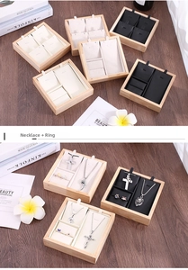 Detailed bamboo jewelry display tray with velvet lining for rings and necklaces