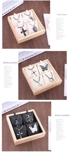 Bamboo jewelry trays shown with grey velvet, white leather, and black leather lining