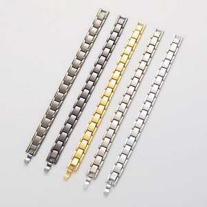 Detail showing six titanium steel magnetic therapy bracelets in various metallic finishes