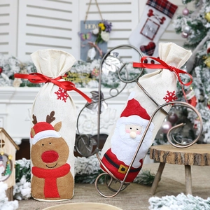 Set of two Christmas wine bottle gift bags with reindeer and Santa Claus applique decor