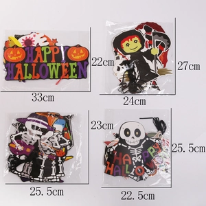 Detail view of assorted Halloween paper banners featuring pumpkins and skeletons motifs