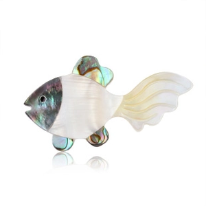 Macro shot of a goldfish brooch crafted with white shell and iridescent abalone shell