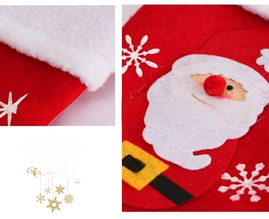 Detail of felt Christmas stocking with Santa Claus applique and plush cuff for holiday decor