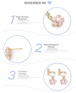 Detail view of pink enamel flower earrings with pearls and hypoallergenic hooks and clips