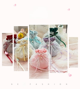 Detail showing velvet wedding gift bags with star sequin mesh and pearl drawstrings