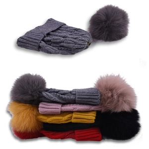 Winter knit baby beanie with detachable faux fur pompom and classic cable texture