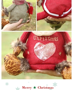 Close-up of red burlap Christmas gift bag with detailed embroidery and zipper closure
