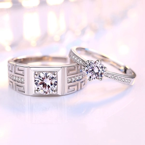 Elegant silver couple rings with six-prong diamond setting and classic Greek key pattern