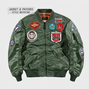 Close-up of military themed embroidery patches on green MA-1 bomber jacket sleeve