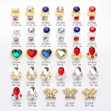 Macro shot of assorted alloy nail art charms with heart and floral shapes in a grid layout