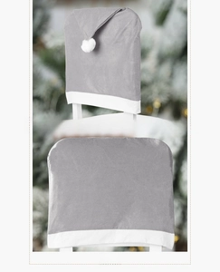 Detailed side and back view of gray plush Christmas chair covers with white pom-poms