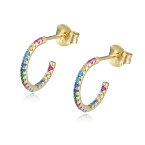 Macro shot of 925 sterling silver C-shaped gold earrings with colorful zircon stones