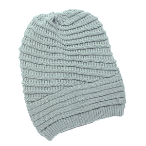 Detailed close-up showing light gray knit texture and horizontal ribbed pattern of the beanie