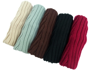 Detailed ribbed knit texture of winter headbands in beige, green, brown, black and burgundy