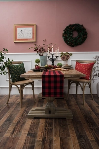 Christmas table runner featuring classic red and black plaid pattern in a festive setting
