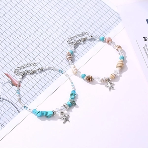 Ensemble de bracelets bohème étoile de mer avec perles turquoise et détails de coquillage