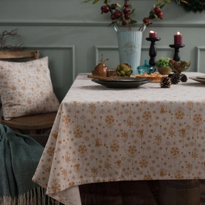 Christmas tablecloth with gold snowflake prints on green linen fabric for holiday decor