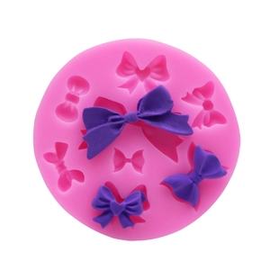 Pink round silicone mold for bow shaped fondant decorations and handmade resin crafts