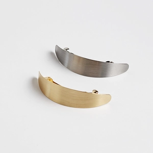Set of gold and silver matte brushed crescent hair clips with spring closure