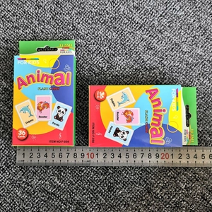 Detailed view of animal flash cards set for kids showing package dimensions with a ruler