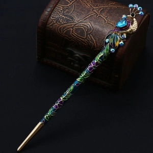 Vintage peacock hair pin with crystals and colorful cloisonne enamel on a dark background